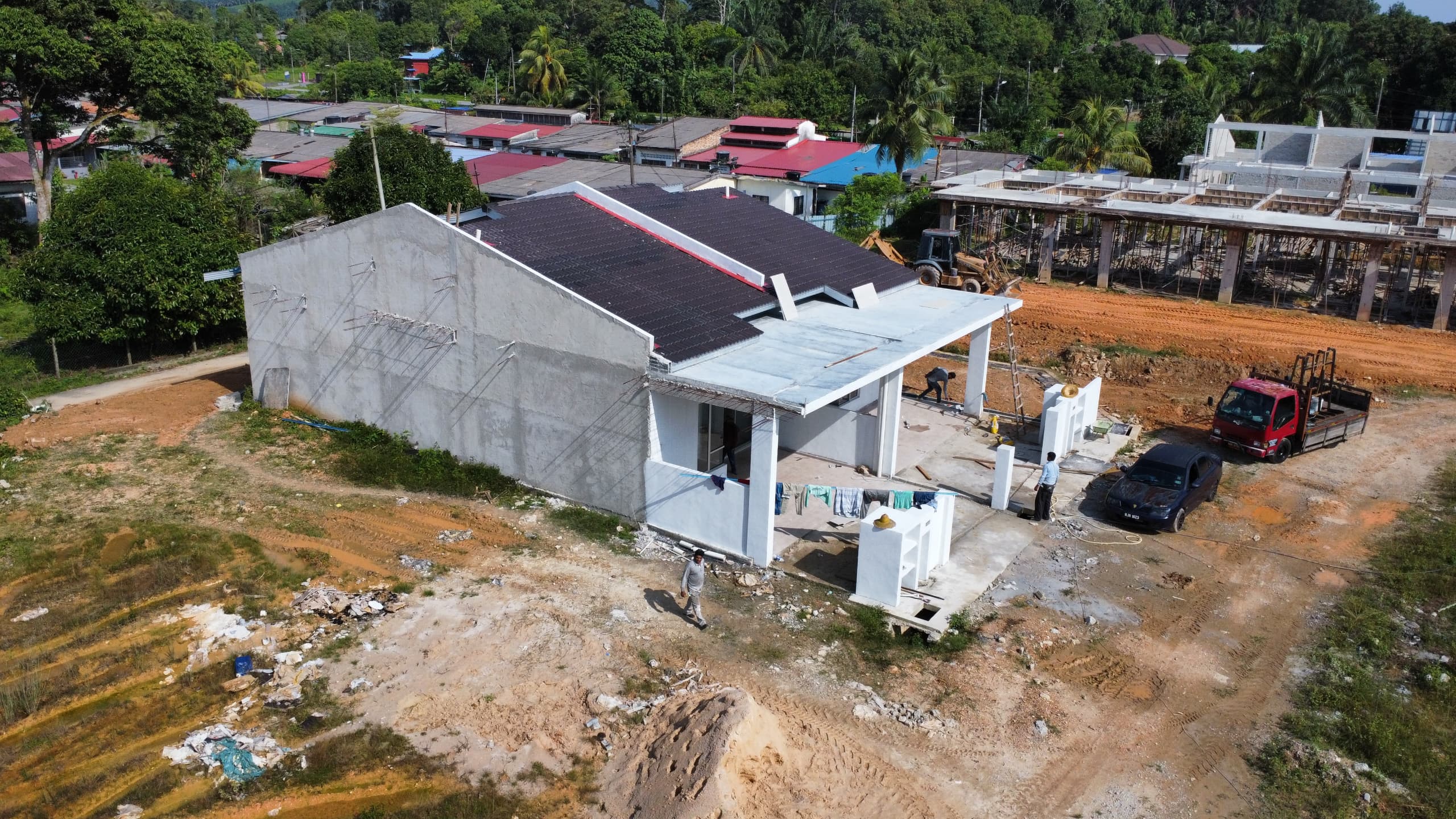 Another view of nearly completed house with dark roof
